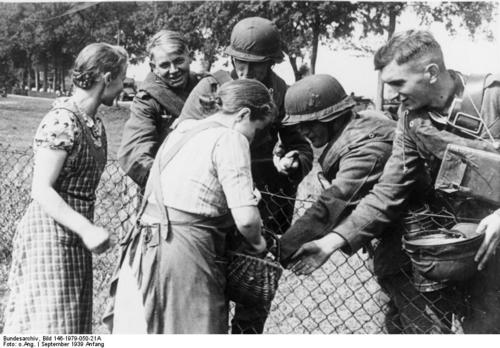 German women living in Poland giving bread to German soldiers_ Poland_ 2 Sep 1939.jpg