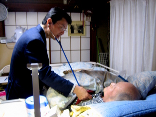 往診中