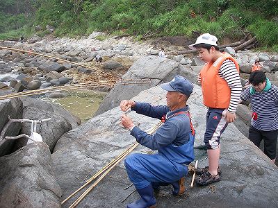 釣りの指導は，吉田長吉さん