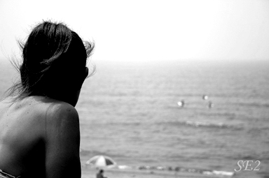 A surfer girl on the beach