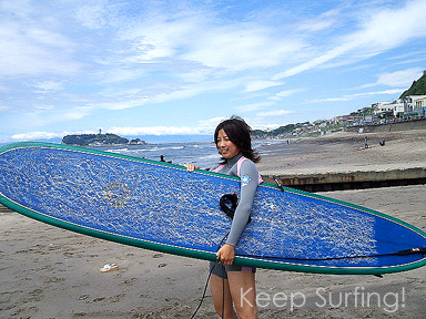 Surfer Girl On The Beach