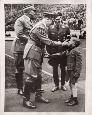 Hitler with Hitler Jugend high leader, and young youth during the May Day celebration at the Olympic Stadium_ Dated May 9, 1938.jpg
