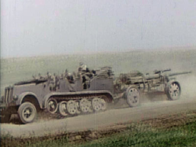 sdkfz-7 and artillery piece.jpg