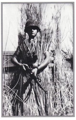 SS sniper from the Das Reich Division in an inventive bit of camoflage.jpg