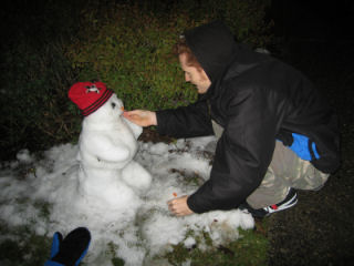 Ben is feeding to snow man