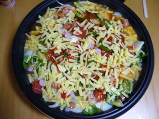ピザ風チーズもんじゃ　チーズたっぷりかけて.jpg