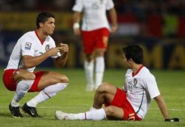 Cristiano Ronaldo reacts next to his teammate Deco during their 2010 World Cup qualifying soccer match against Hungary at Puskas stadium.jpg