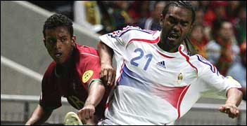 Florent Sinama-Pongolle (right) tackles Nani of Portugal.jpg
