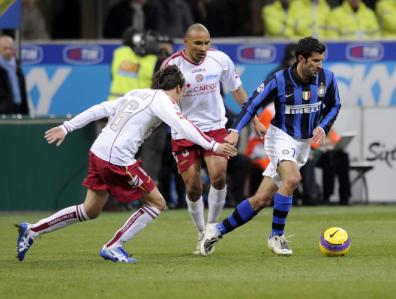 Luis Figo runs with the ball despite Tommaso Vailatti during the Italian Serie A football match Inter Milan against Livorno.jpg