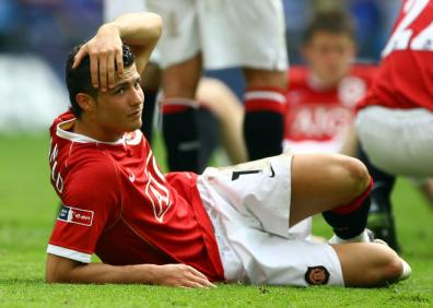 Cristiano Ronaldo looks dejected following defeat in the FA Cup Final match sponsored by E-ON between Manchester United and Chelsea at Wembley Stadium.jpg