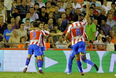Simao Sabrosa celebrates with Antonio Lopez after scoring against Valencia during their Spanish league football match at Mestalla stadium.jpg