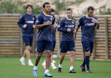 Nani runs with his teammates during a training session of Portugals national soccer team Friday in Obidos.jpg