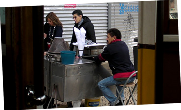 roast-chestnut stall in Praca da Figueira, Portugal