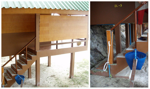 階段脇には水シャワー蛇口とバスケットゴミ箱