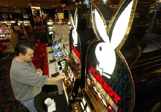 TERRY Fowler of Burbank, Calif. tries his luck on a new Playboy-themed slot machine at the Imperial Palace 2002